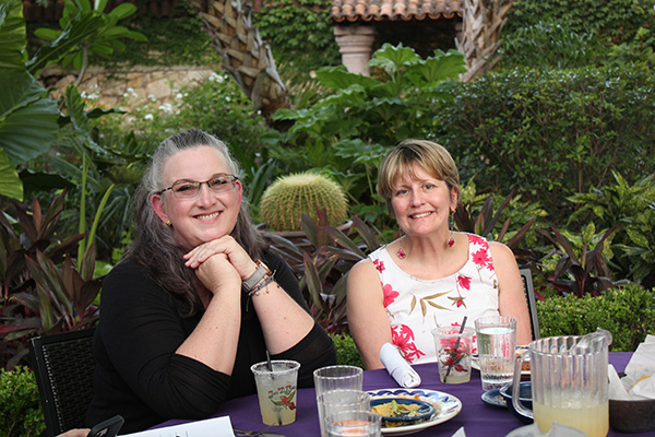 Smiles all around with a beautiful garden backdrop